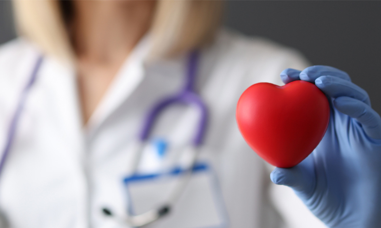 doctor holding red heart