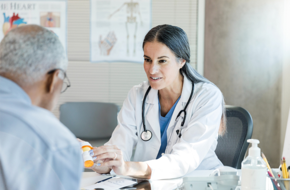 physician discussing medication with a patient in a doctor's office
