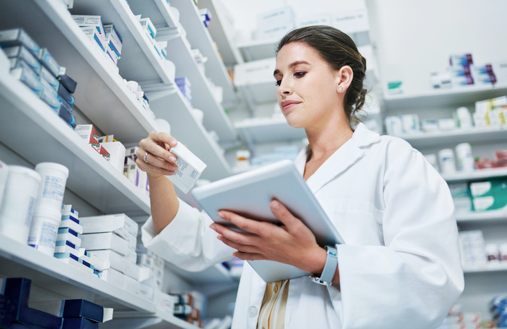 pharmacist using free ce on a tablet device at work