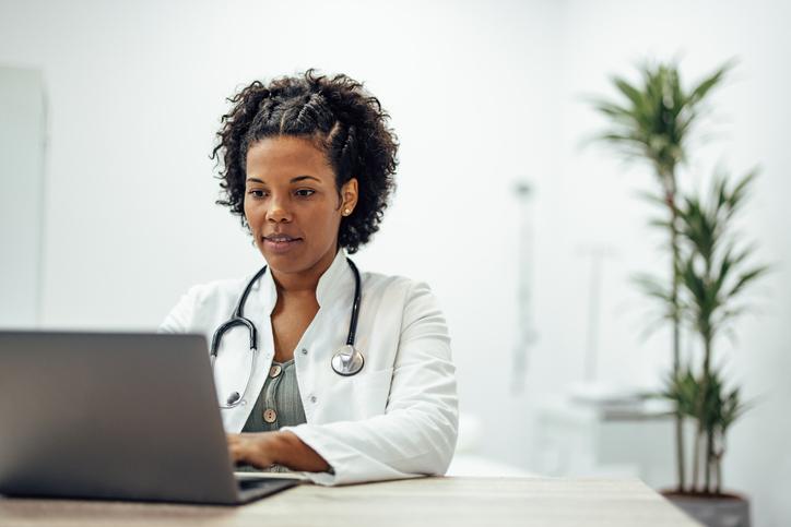 female doctor working on a laptop